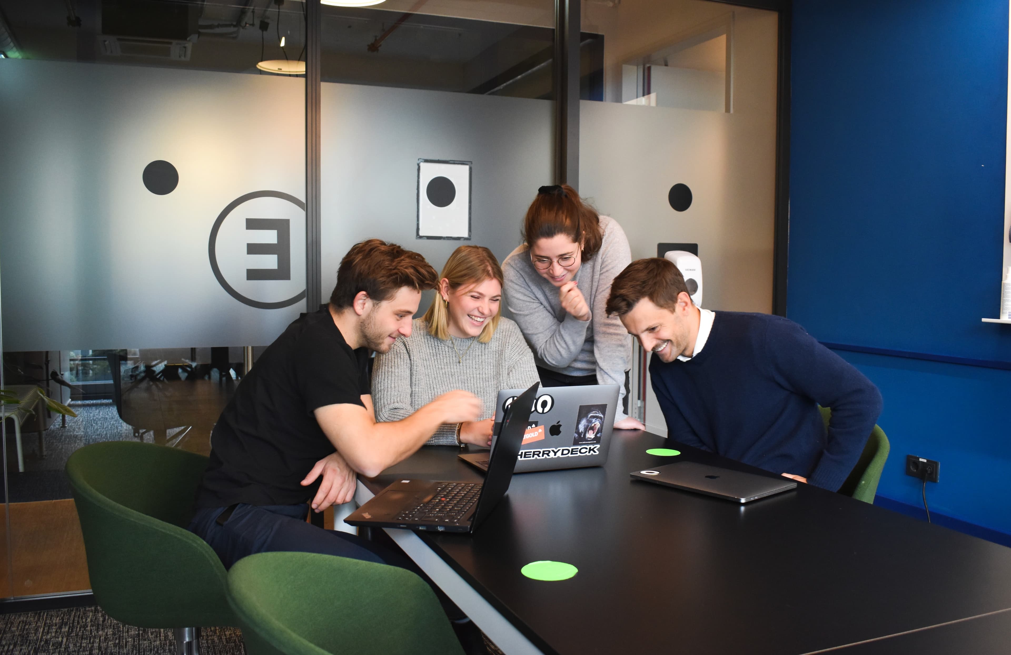 People working together at a laptop