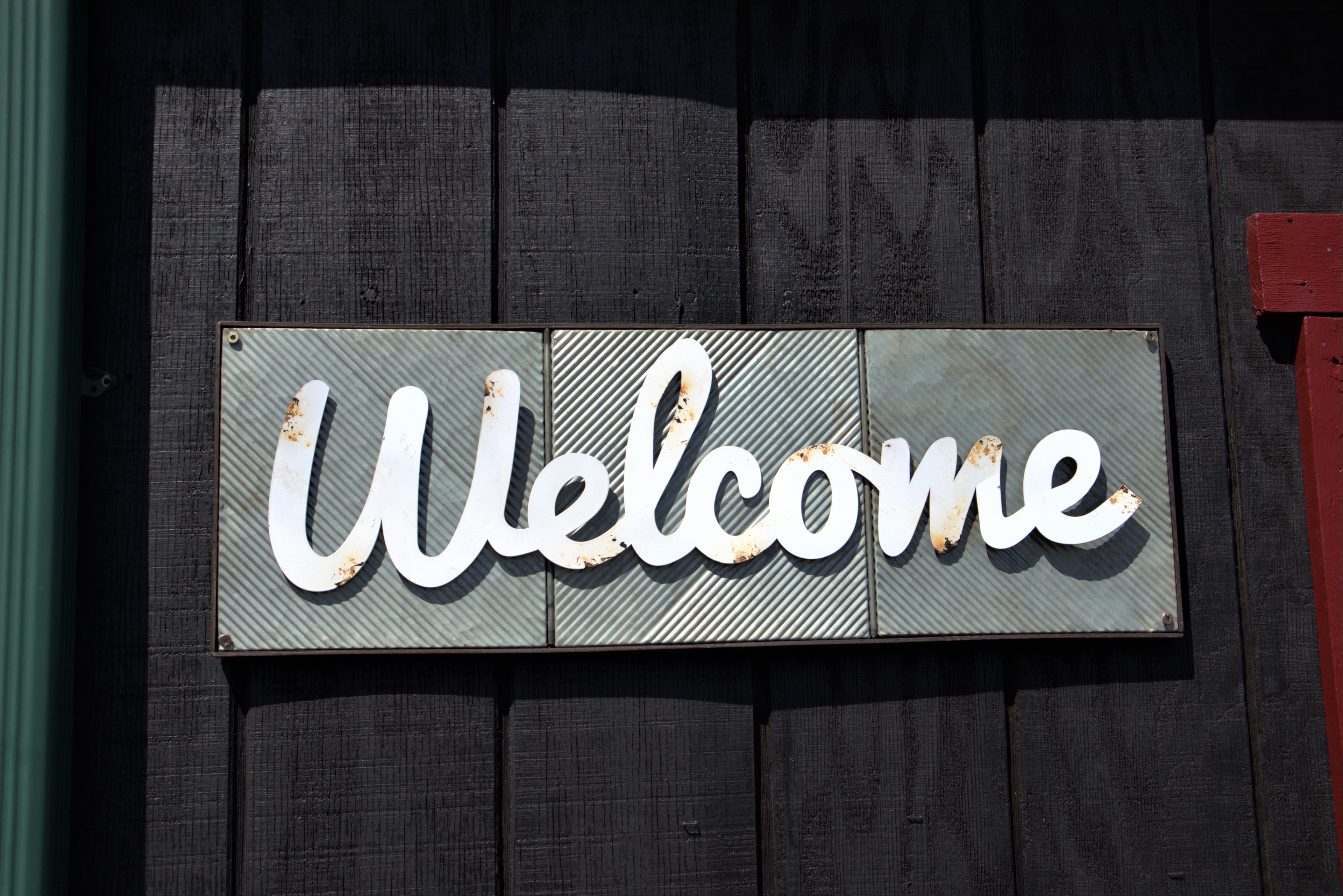 A welcome sign at an entrance